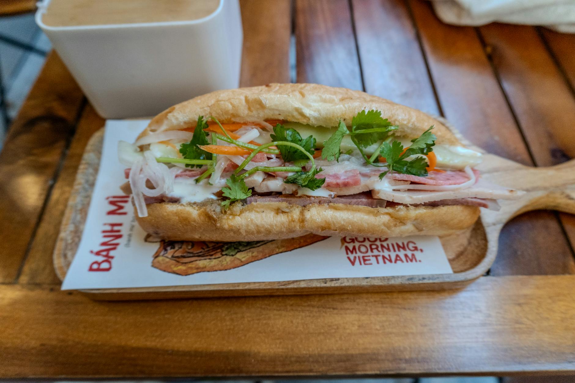 Banh mi being prepared at a Saigon street stall